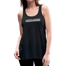 Load image into Gallery viewer, Woman wearing a black flowy racerback style tank top, featuring the Cuomo Sapiens S.U.D.L.T. graphic in white.