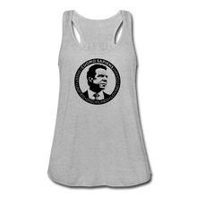 Load image into Gallery viewer, A women’s flowy, racerback style tank top, in white, on a transparent body form, featuring the Cuomo Sapiens S.U.D.L.T. SEAL graphic in black.
