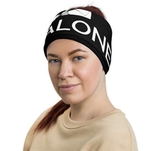 Load image into Gallery viewer, Front-view of a woman wearing a black neck gaiter in the headband configuration, featuring the Cuomo Sapiens NO BALONEY graphic in white.