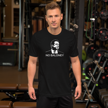 Load image into Gallery viewer, Man at the gym, wearing a black unisex t-shirt, featuring the Cuomo Sapiens NO BALONEY graphic in white.