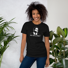 Load image into Gallery viewer, Woman standing next to some plants, wearing a black unisex t-shirt, featuring the Cuomo Sapiens NO BALONEY graphic in white.