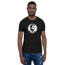 Load image into Gallery viewer, Man wearing a black unisex t-shirt, featuring the Cuomo Sapiens S.U.D.L.T. SEAL graphic in white.