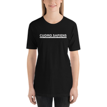 Load image into Gallery viewer, Woman wearing a black unisex t-shirt, featuring the Cuomo Sapiens S.U.D.L.T. SEAL graphic in white.