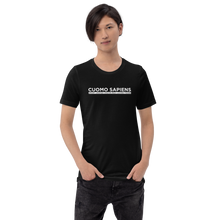 Load image into Gallery viewer, Man wearing a black unisex t-shirt, featuring the Cuomo Sapiens S.U.D.L.T. graphic in white.