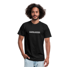 Load image into Gallery viewer, Man wearing a black unisex t-shirt, featuring the Cuomo Sapiens S.U.D.L.T. graphic in white.