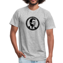 Load image into Gallery viewer, Man wearing a heather grey unisex t-shirt, featuring the Cuomo Sapiens S.U.D.L.T. SEAL graphic in black.