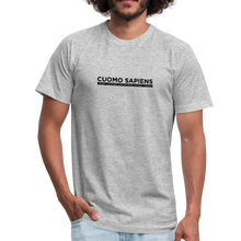 Load image into Gallery viewer, Man wearing a heather grey unisex t-shirt, featuring the Cuomo Sapiens S.U.D.L.T. graphic in black.