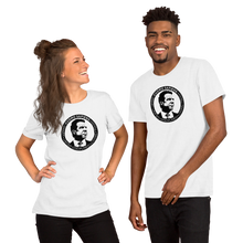 Load image into Gallery viewer, A woman and a man wearing white unisex t-shirts, featuring the Cuomo Sapiens S.U.D.L.T. SEAL graphic in black.