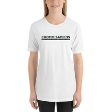 Load image into Gallery viewer, Woman wearing a white unisex t-shirt, featuring the Cuomo Sapiens S.U.D.L.T. graphic in black.
