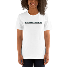 Load image into Gallery viewer, Woman wearing a white unisex t-shirt, featuring the Cuomo Sapiens S.U.D.L.T. graphic in black.
