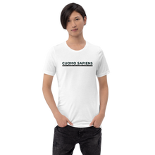 Load image into Gallery viewer, Man wearing a white unisex t-shirt, featuring the Cuomo Sapiens S.U.D.L.T. graphic in black.