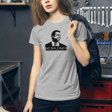 Load image into Gallery viewer, Woman with a leather jacket in a garage, wearing a heather grey premium women’s slim-fit t-shirt, featuring the Cuomo Sapiens NO BALONEY graphic in black.