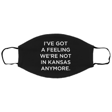 Load image into Gallery viewer, Cuomo Sapiens 3-ply protective face mask, in black, featuring white type that reads &#39;I&#39;ve got a feeling we&#39;re not in Kansas anymore.&#39;
