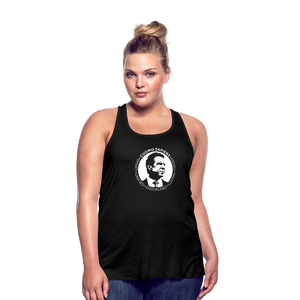 A curvy woman wearing a black flowy racerback style tank top, featuring the Cuomo Sapiens S.U.D.L.T. SEAL graphic in white.