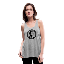 Load image into Gallery viewer, Woman wearing a heather grey flowy racerback style tank top, featuring the Cuomo Sapiens S.U.D.L.T. SEAL graphic in black.
