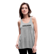 Load image into Gallery viewer, Woman wearing a heather grey flowy racerback style tank top, featuring the Cuomo Sapiens S.U.D.L.T. graphic in black.
