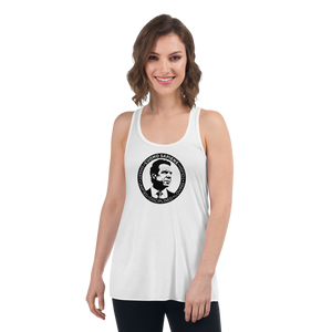 Woman wearing a white flowy racerback style tank top, featuring the Cuomo Sapiens S.U.D.L.T. SEAL graphic in black.
