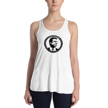 Load image into Gallery viewer, Woman wearing a white flowy racerback style tank top, featuring the Cuomo Sapiens S.U.D.L.T. SEAL graphic in black.
