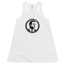 Load image into Gallery viewer, A women’s flowy, racerback style tank top, in white, lying wrinkled on a flat surface, featuring the Cuomo Sapiens S.U.D.L.T. SEAL graphic in black.
