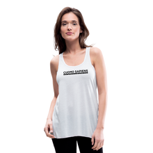 Load image into Gallery viewer, Woman wearing a white flowy racerback style tank top, featuring the Cuomo Sapiens S.U.D.L.T. graphic in black.
