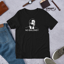 Load image into Gallery viewer, A black unisex t-shirt on the floor, featuring the Cuomo Sapiens NO BALONEY graphic in white.
