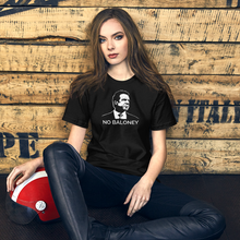 Load image into Gallery viewer, Woman with a motorcycle helmet next to some crates, wearing a black unisex t-shirt, featuring the Cuomo Sapiens NO BALONEY graphic in white.
