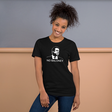Load image into Gallery viewer, Woman standing against a wall, wearing a black unisex t-shirt, featuring the Cuomo Sapiens NO BALONEY graphic in white.

