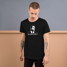 Load image into Gallery viewer, Man standing against a wall, wearing a black unisex t-shirt, featuring the Cuomo Sapiens NO BALONEY graphic in white.
