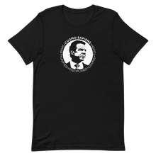 Load image into Gallery viewer, A black unisex t-shirt on a flat surface, featuring the Cuomo Sapiens S.U.D.L.T. SEAL graphic in white.
