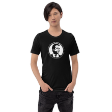 Load image into Gallery viewer, Man wearing a black unisex t-shirt, featuring the Cuomo Sapiens S.U.D.L.T. SEAL graphic in white.
