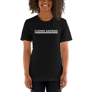 Woman wearing a black unisex t-shirt, featuring the Cuomo Sapiens S.U.D.L.T. graphic in white.