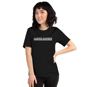 Woman wearing a black unisex t-shirt, featuring the Cuomo Sapiens S.U.D.L.T. graphic in white.