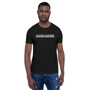 Man wearing a black unisex t-shirt, featuring the Cuomo Sapiens S.U.D.L.T. graphic in white.