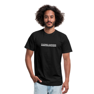Man wearing a black unisex t-shirt, featuring the Cuomo Sapiens S.U.D.L.T. graphic in white.