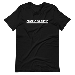 A black unisex t-shirt lying wrinkled on a flat surface, featuring the Cuomo Sapiens S.U.D.L.T. graphic in white.