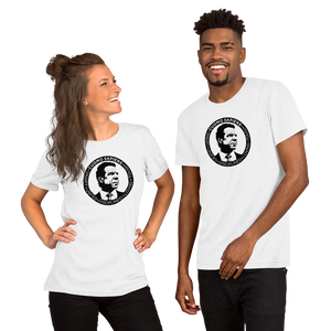 A woman and a man wearing white unisex t-shirts, featuring the Cuomo Sapiens S.U.D.L.T. SEAL graphic in black.