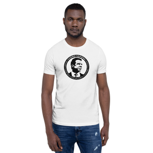 Man wearing a white unisex t-shirt, featuring the Cuomo Sapiens S.U.D.L.T. SEAL graphic in black.