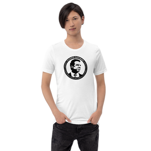 Man wearing a white unisex t-shirt, featuring the Cuomo Sapiens S.U.D.L.T. SEAL graphic in black.