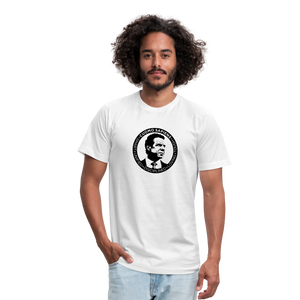 Man wearing a white unisex t-shirt, featuring the Cuomo Sapiens S.U.D.L.T. SEAL graphic in black.