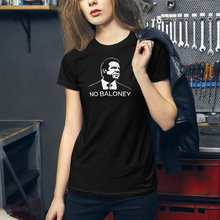 Load image into Gallery viewer, Woman with a leather jacket in a garage, wearing a black premium women’s slim-fit t-shirt, featuring the Cuomo Sapiens NO BALONEY graphic in white.

